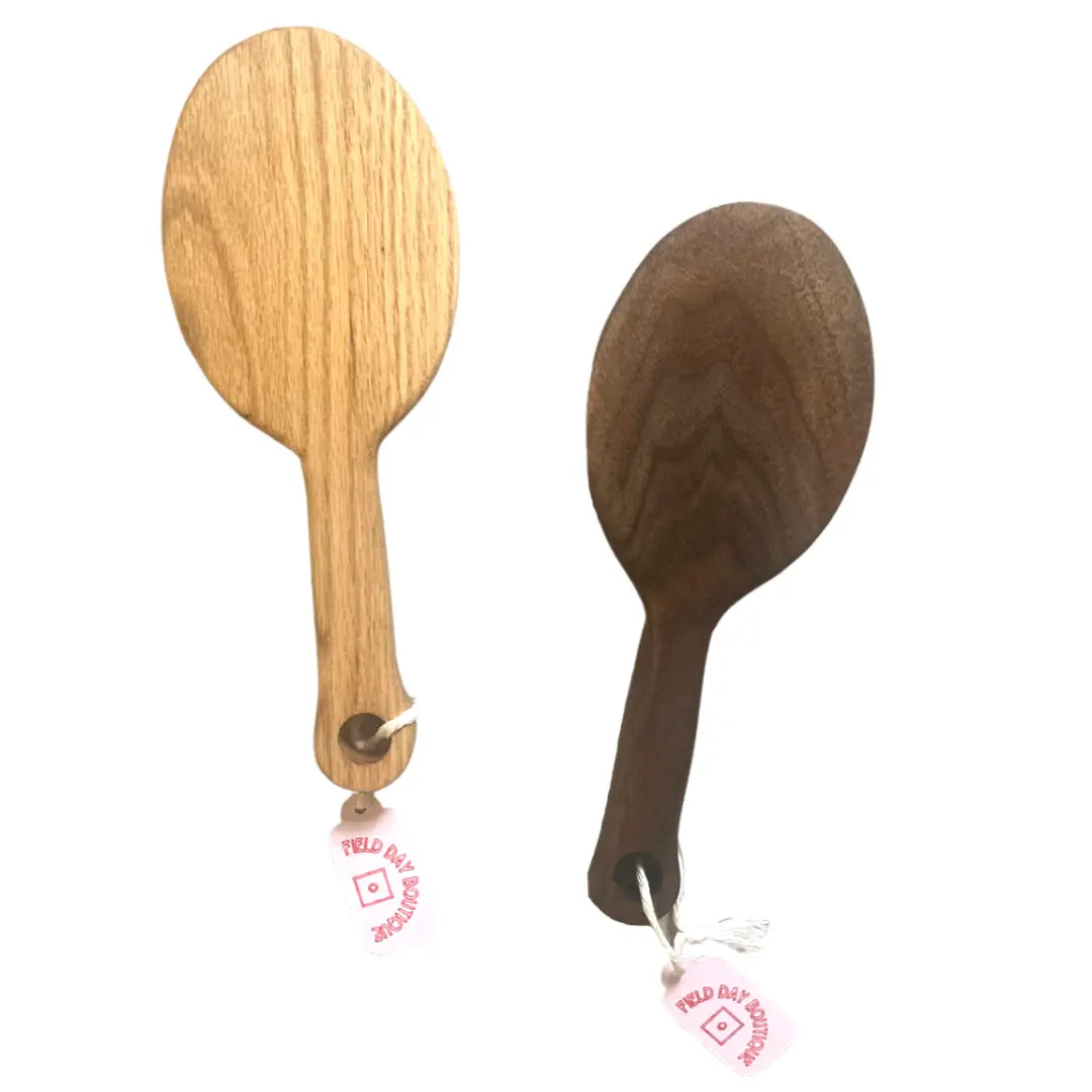 Oval handmade BDSM paddles, one made from ash wood and one made from walnut wood