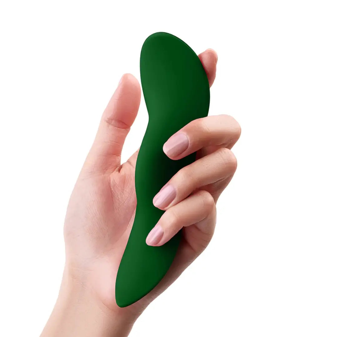 Dark Green FemmeFunn Unda external remote controlled vibrator in hand