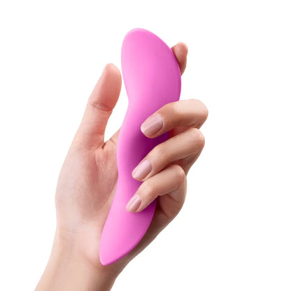 Pink FemmeFunn Unda external remote controlled vibrator in hand