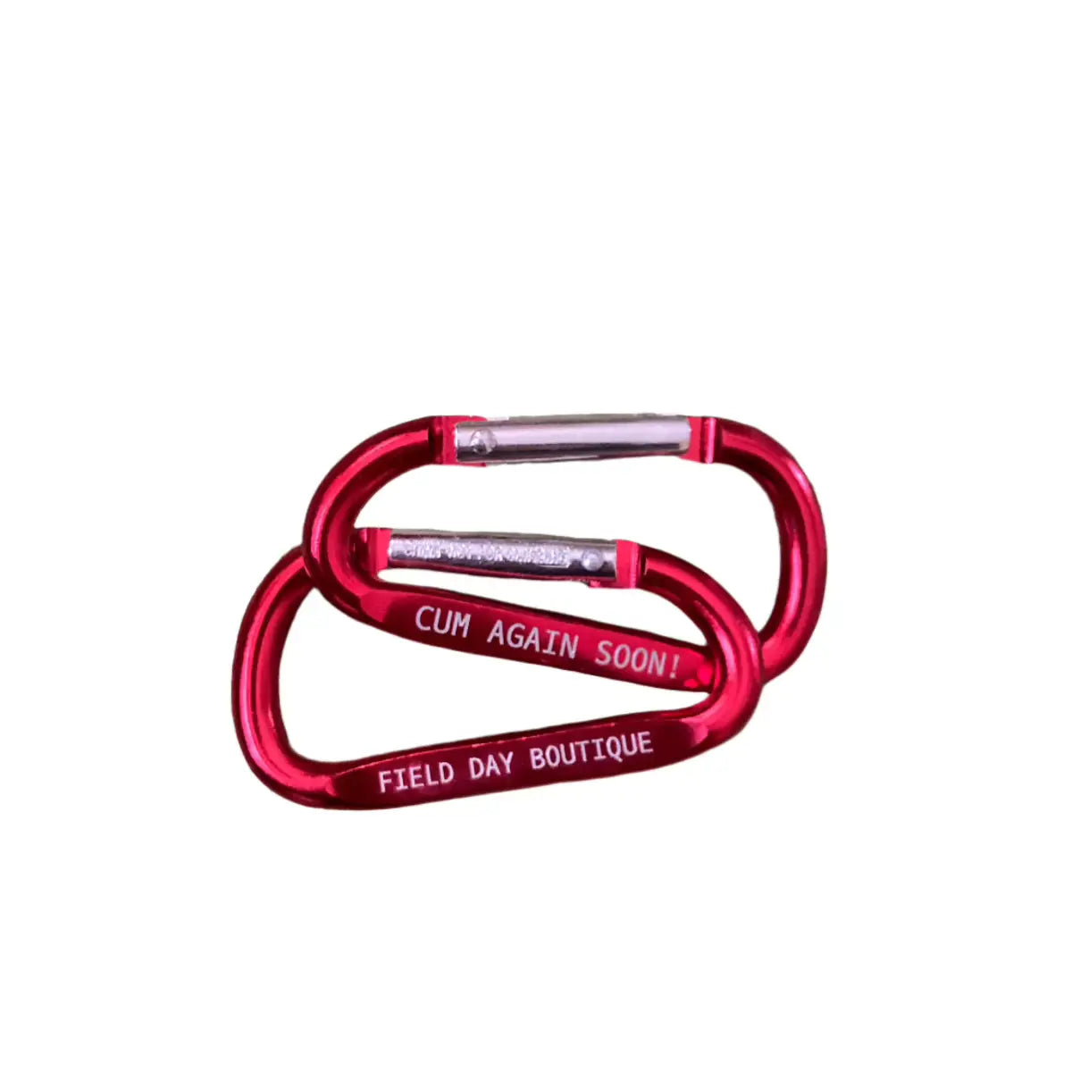 Two red carabiners with engraved writing Field Day Boutique and Cum Again Soon!